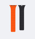 Orange and black Magnetic Link apple watch bands on a light gray background - creslia