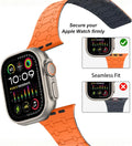 Creslia Magnetic Link Apple watch band  with an orange band, showing a close-up of the band fitting securely.