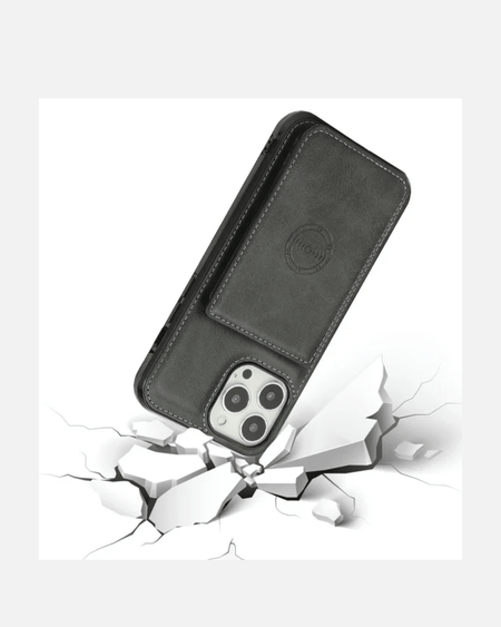 Premium black leather wallet case for iPhone 16 Pro Max, featuring cardholder and stand, showcased on cracked surface.