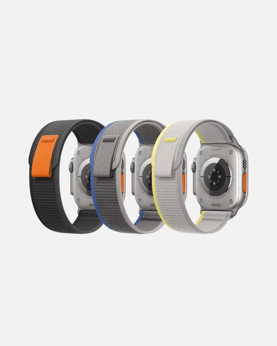 Trail Loop Apple Watch bands in black, blue, and gray, showcasing lightweight, breathable, and adjustable features.